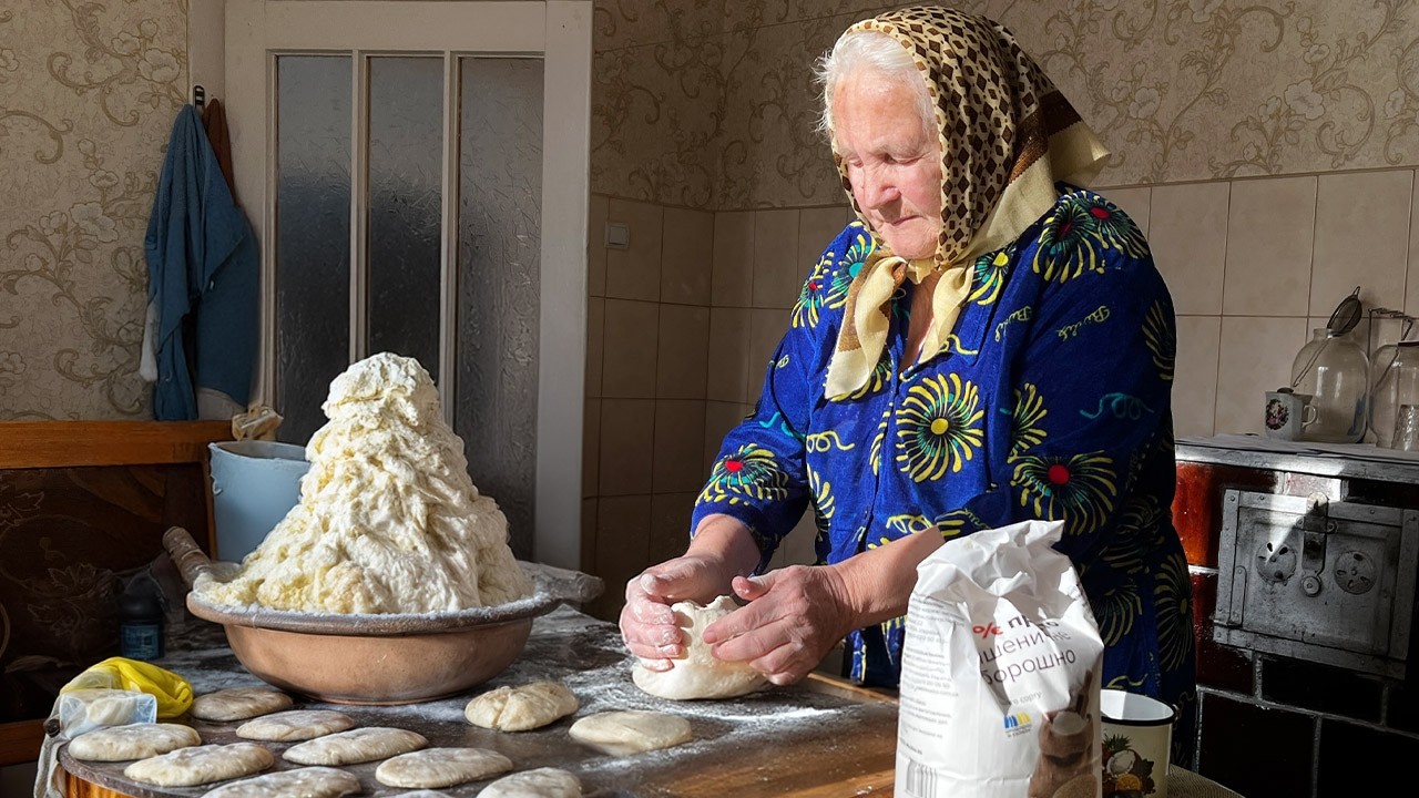 Rural Life with 85-year-old Grandmother in the Mountains Far from Civilization. Ancient Traditions