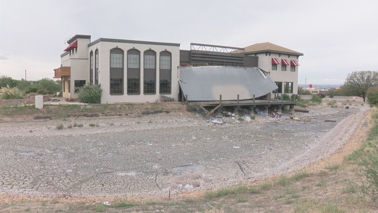 Abandoned restaurant falling to shambles at busy Albuquerque intersection