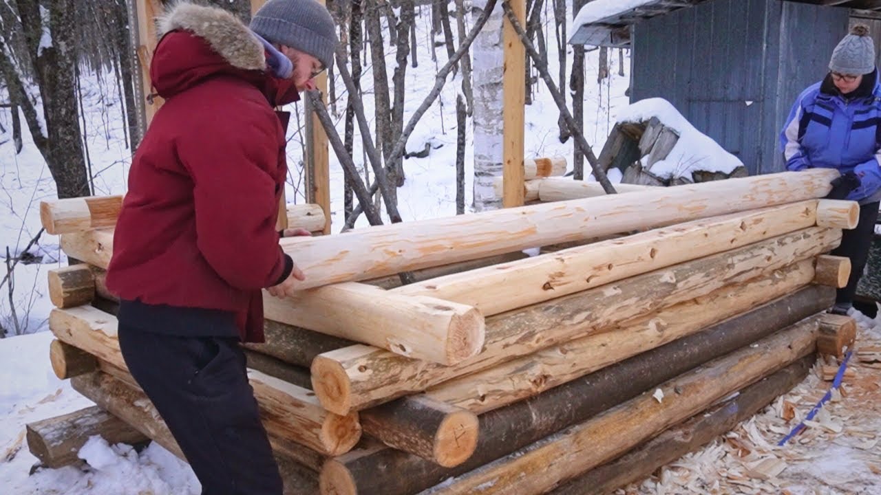 Building a Cedar Log Sauna | Ep. 3 | Working through SNOW + We made a custom door for the sauna