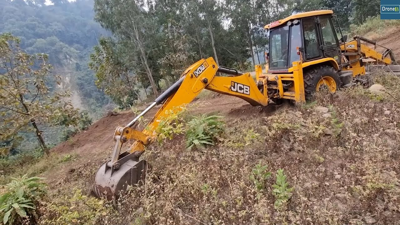 Working for Wider Hillside Road Turn with JCB Backhoe