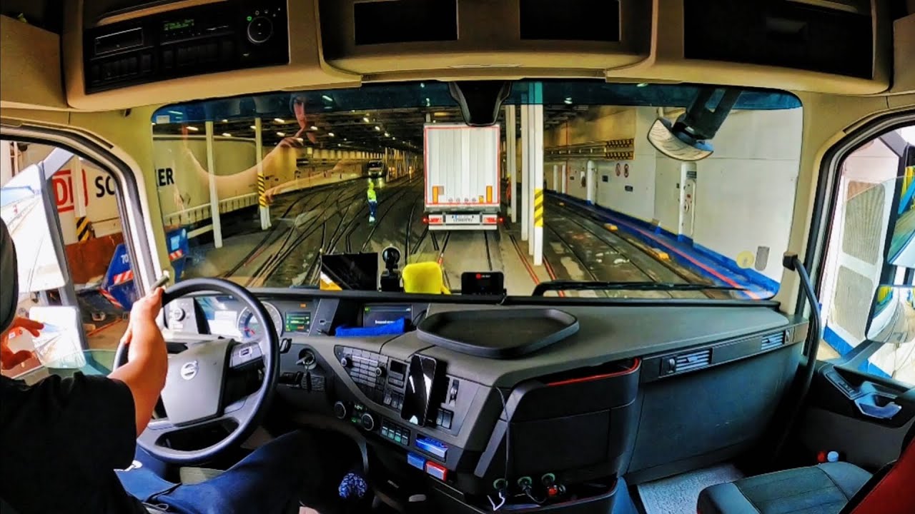 Sailing the Baltic sea on a ferry from Germany to Sweden . Driving Volvo truck .