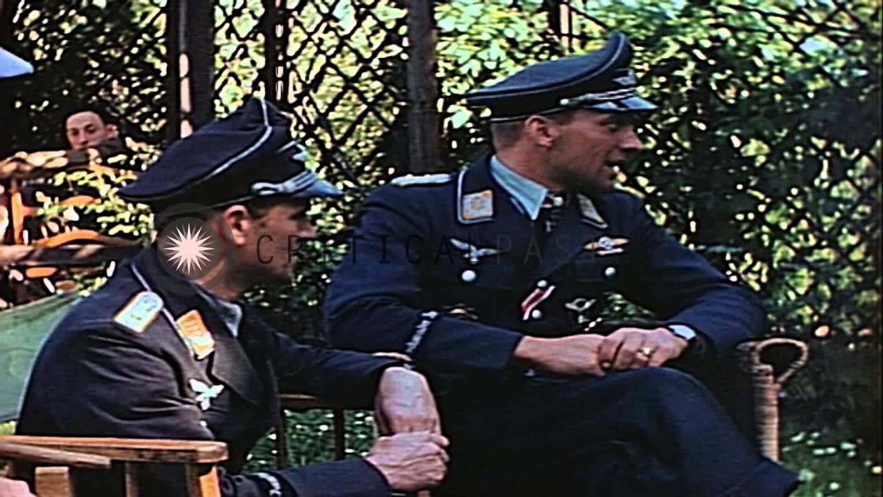 Ace German Air Force Stuka dive bomber pilot Hans-Ulrich Rudel in a garden with A...HD Stock Footage