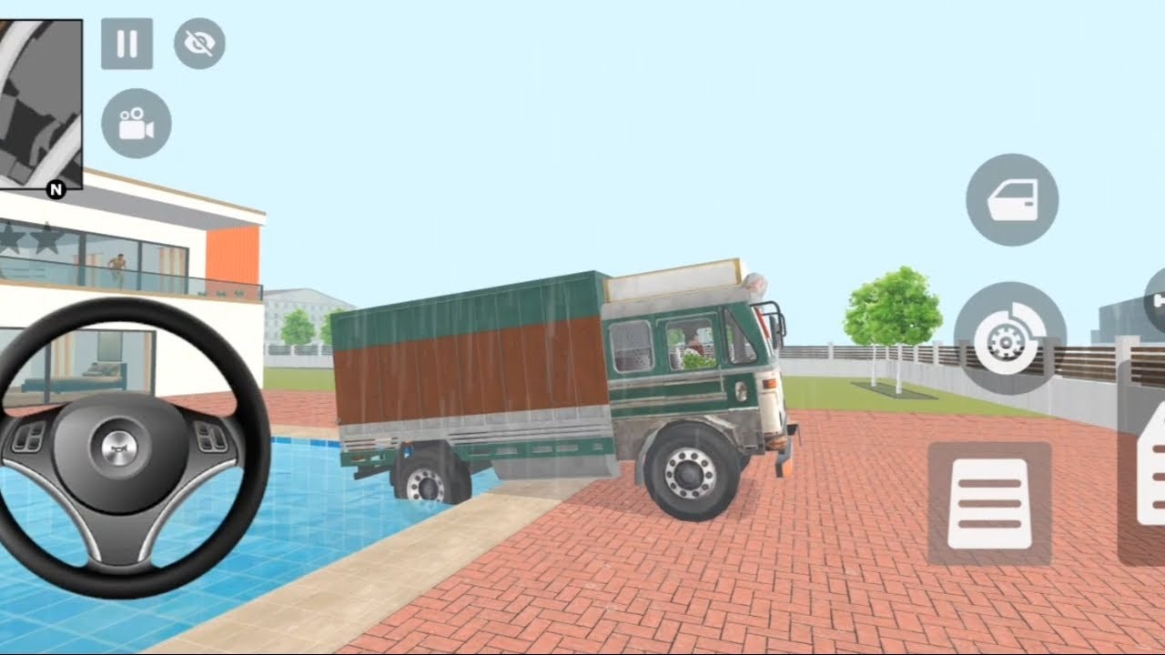 একটি cargo truck আধা পানিতে, আধা রাস্তায় আটকে আছে