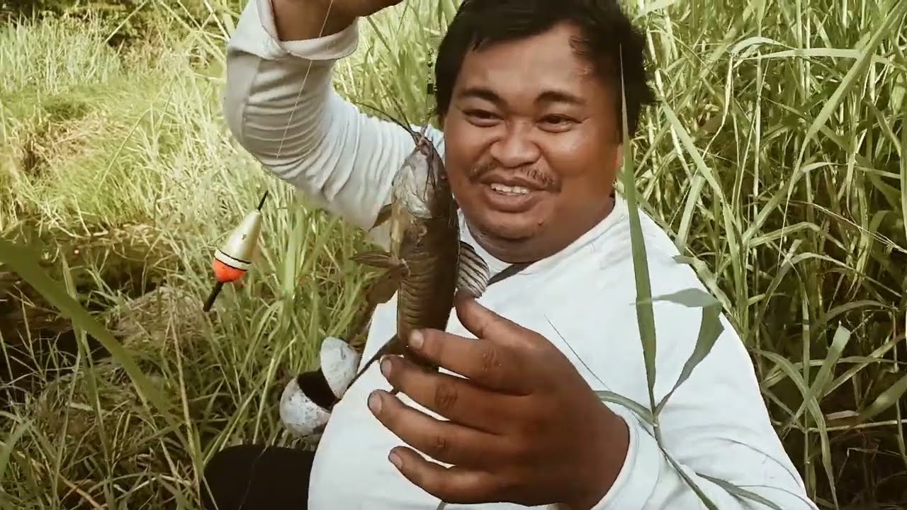 Fishing with bamboo poles alongside remote roads in Suriname