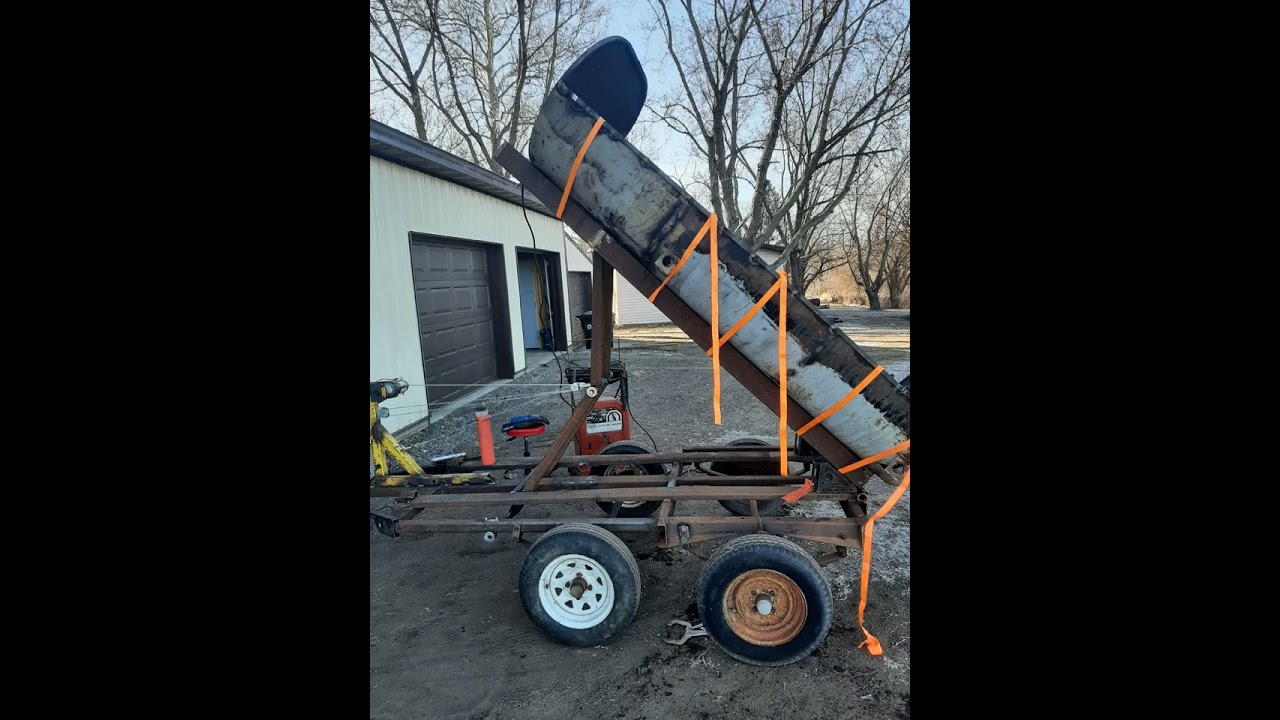 Homemade dump trailer with a winch.