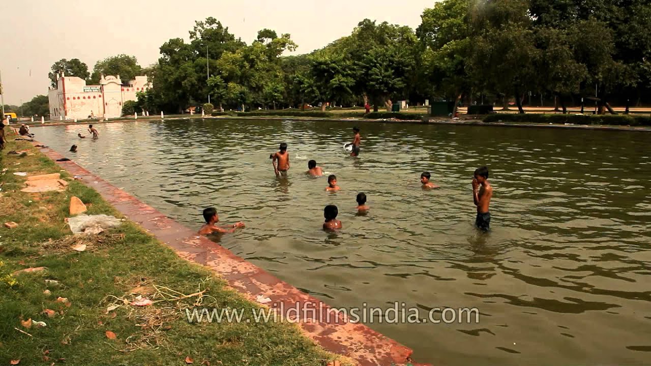 Children playing in a pool at India gate