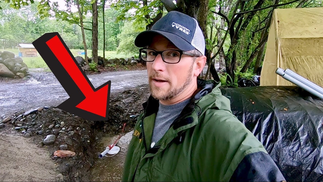 BooYeah This RAIN Cant stop US! Finishing up the under ground utlity Trench