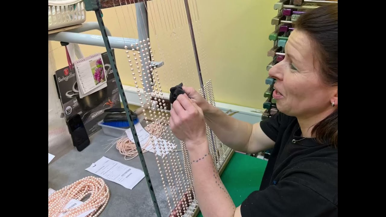 How do they keep the holes open?  Glass Pearl bead painting process explained. Who knew?