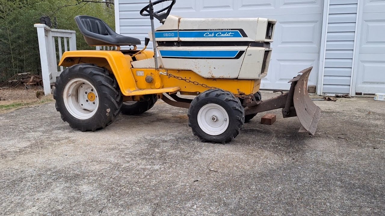 Installing a 42 inch snow plow on a Cub Cadet 1200 wide frame.