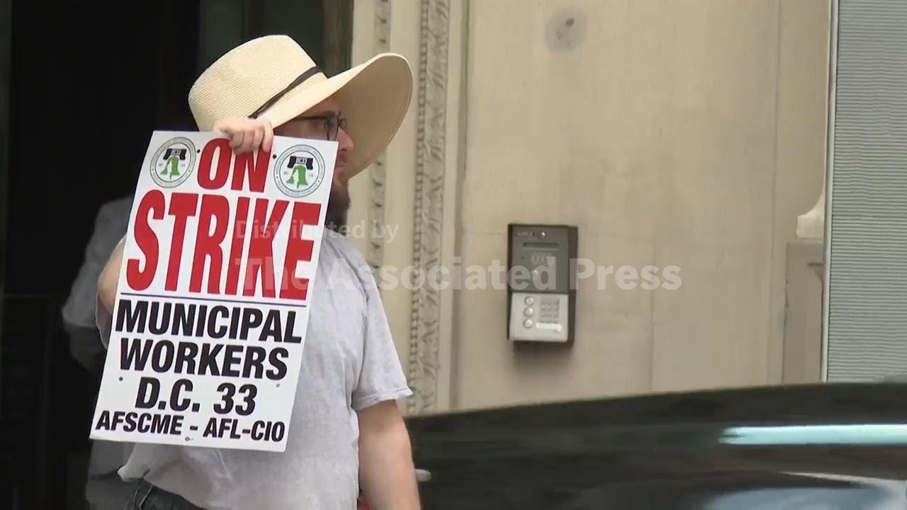 Thousands of city workers strike in Philadelphia, affecting trash pickup, libraries and 911 calls