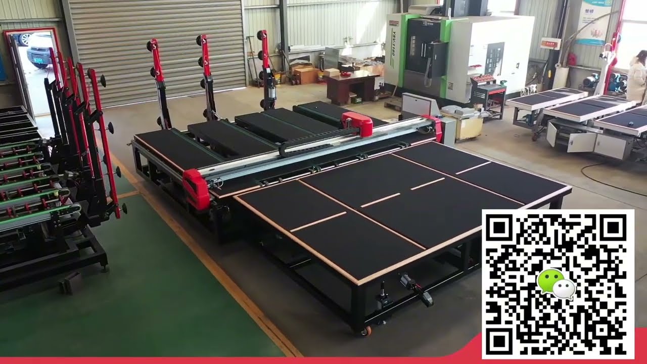 CNC Glass Cutting Machine with automatic glass loading arms and separate glass breaking table