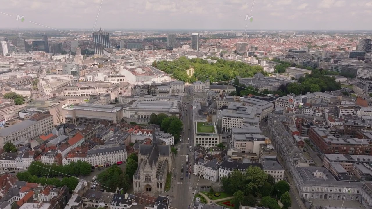Aerial view of Brussels slowly panning across the cityscape. Buildings and streets stretch into the