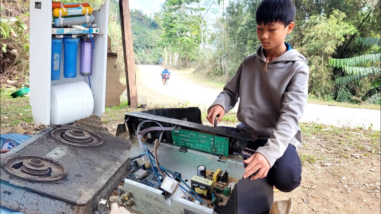 A boy repairs a neighbors water purifier orphansDuynhan