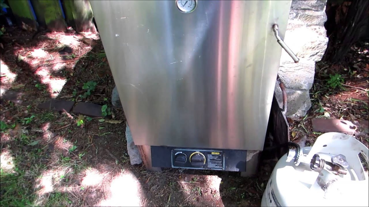 Taupo Fishing: Trout Smoking, 4 large trout in a gas smoker