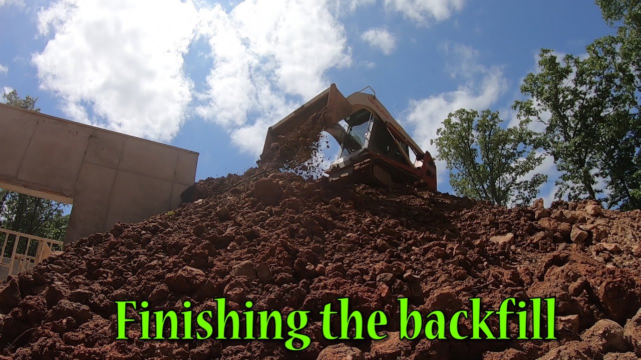 Finishing The Backfill And Burying A Downspout