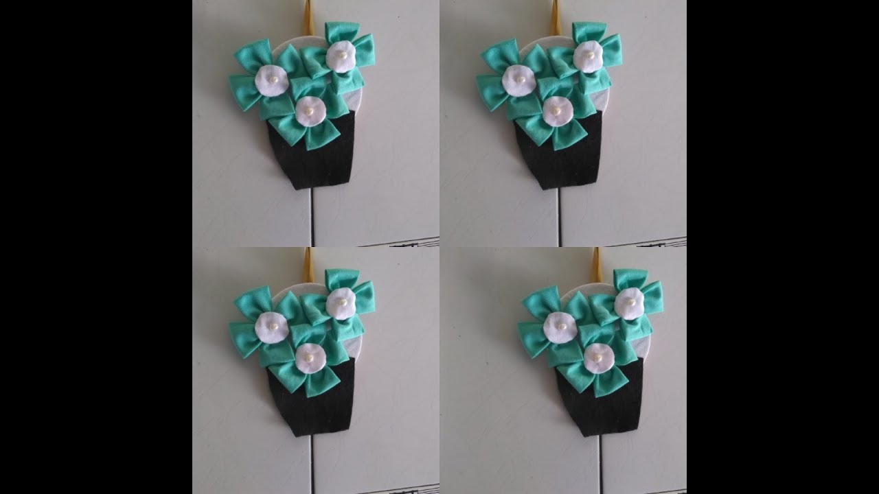 Arranjo de parede feito de CD com fuxico e feltro