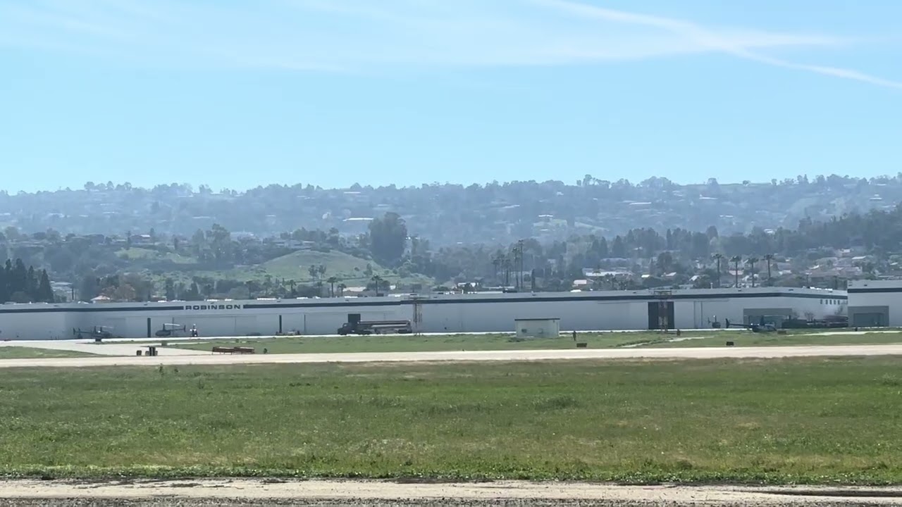 Robinson R22 Helicopter taking off from Torrance Airport 
