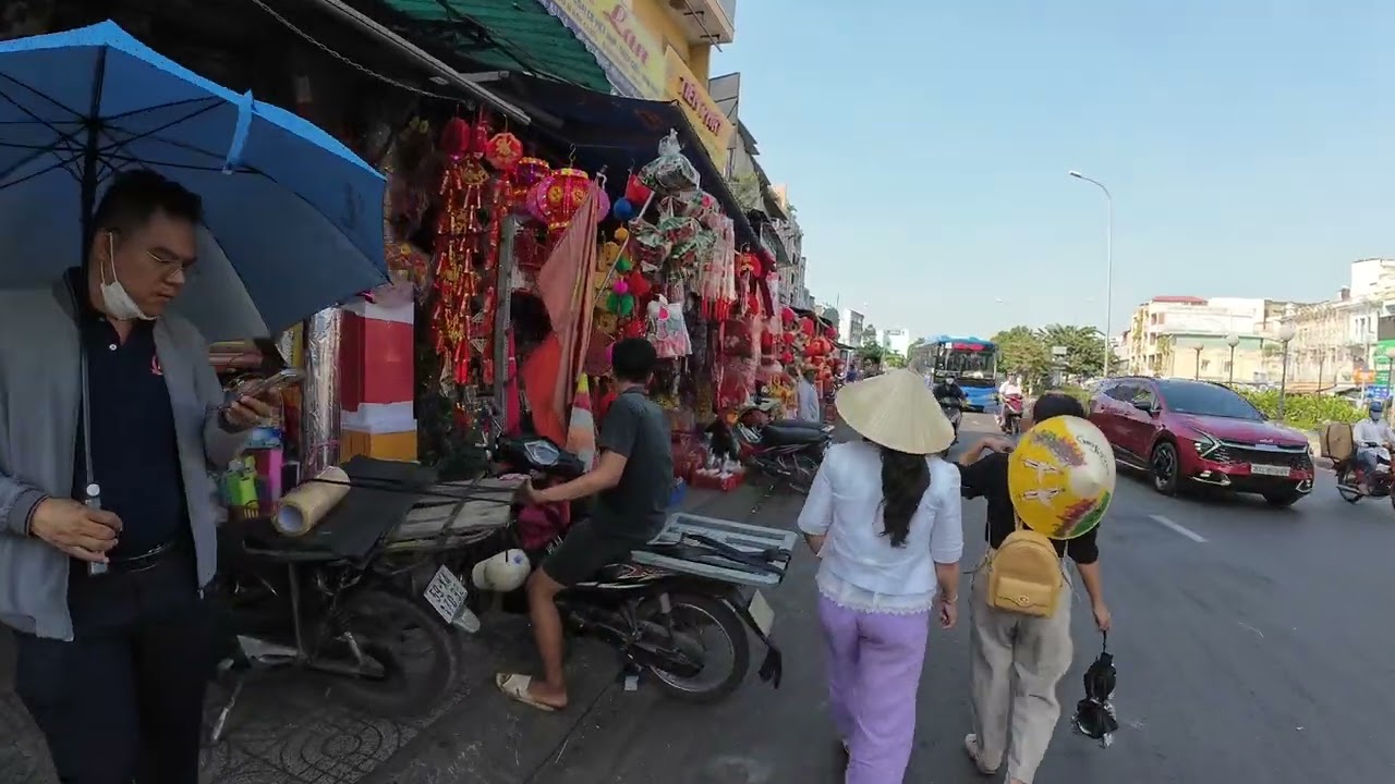 Saigon Chinatown preparing for Lunar New Year   District 5 streets filled with colorful décor items.