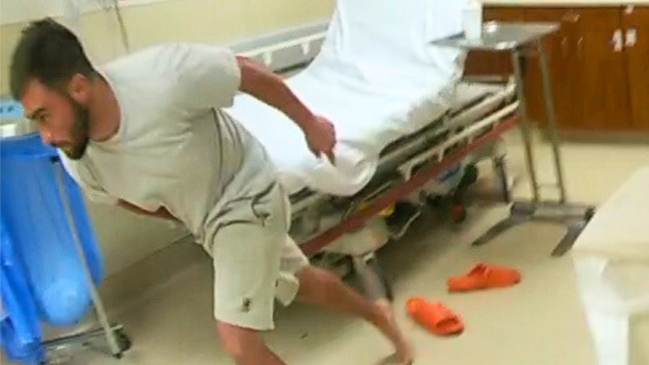 Man Runs Through Hospital&rsquo;s Glass Gate To Escape Cops