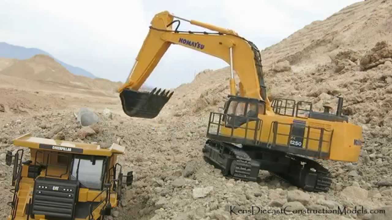 Komatsu PC1250 loading CAT 775G