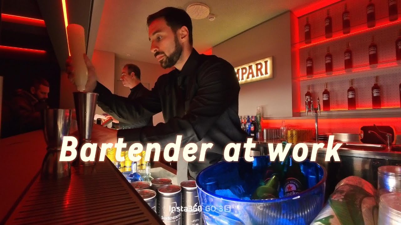 Bartender at Work during a busy shift in Milan. Speed Working.