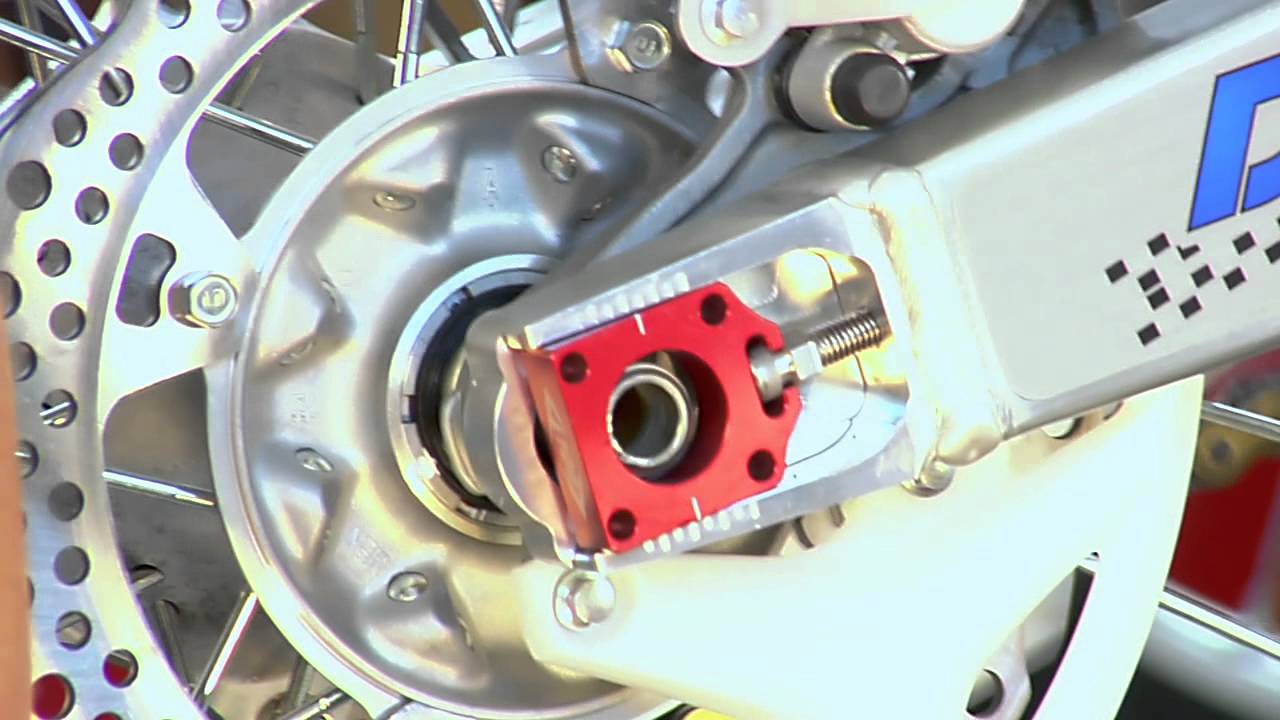 How to install chain adjuster blocks on an off-road motorcycle