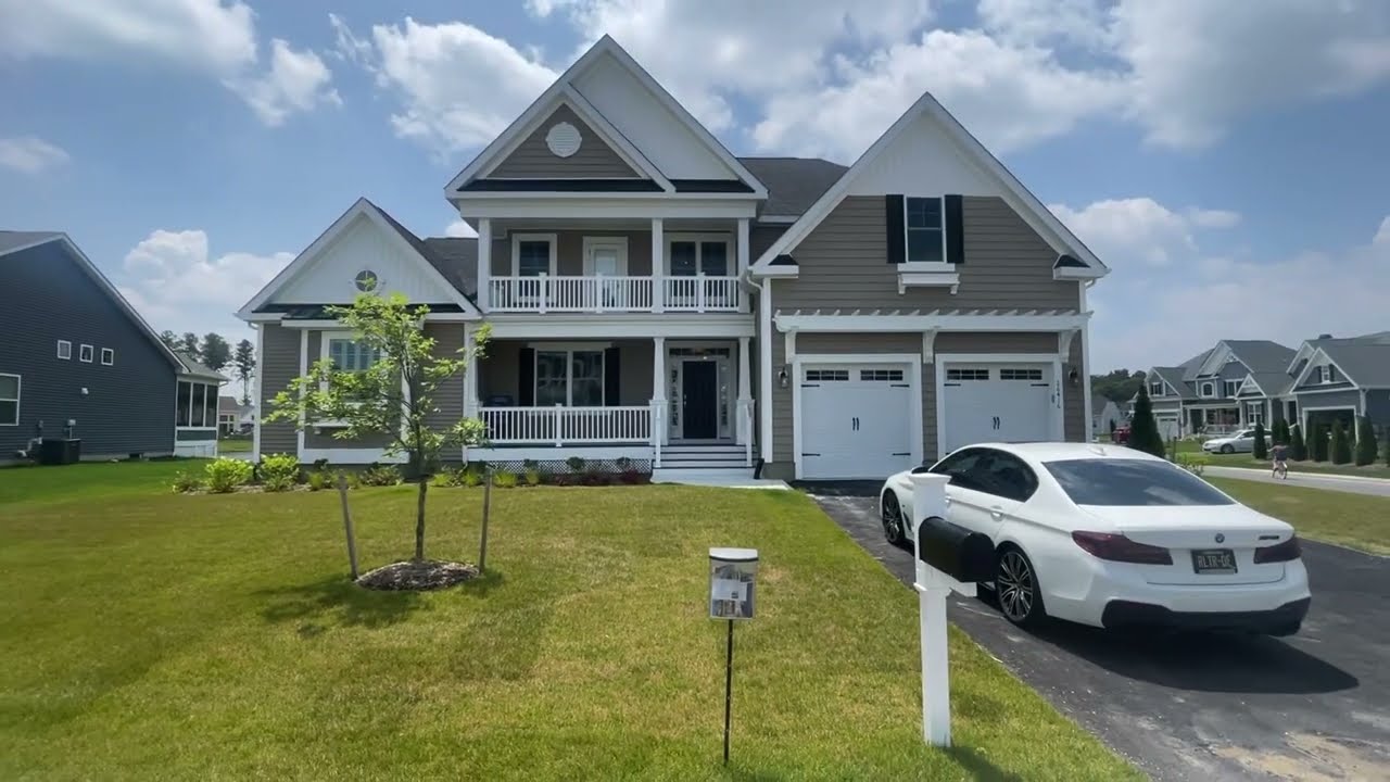 $949,900 | Cory Mayo tours 26416 Tributary Blvd, community of Peninsula Lakes in Millsboro, DE.