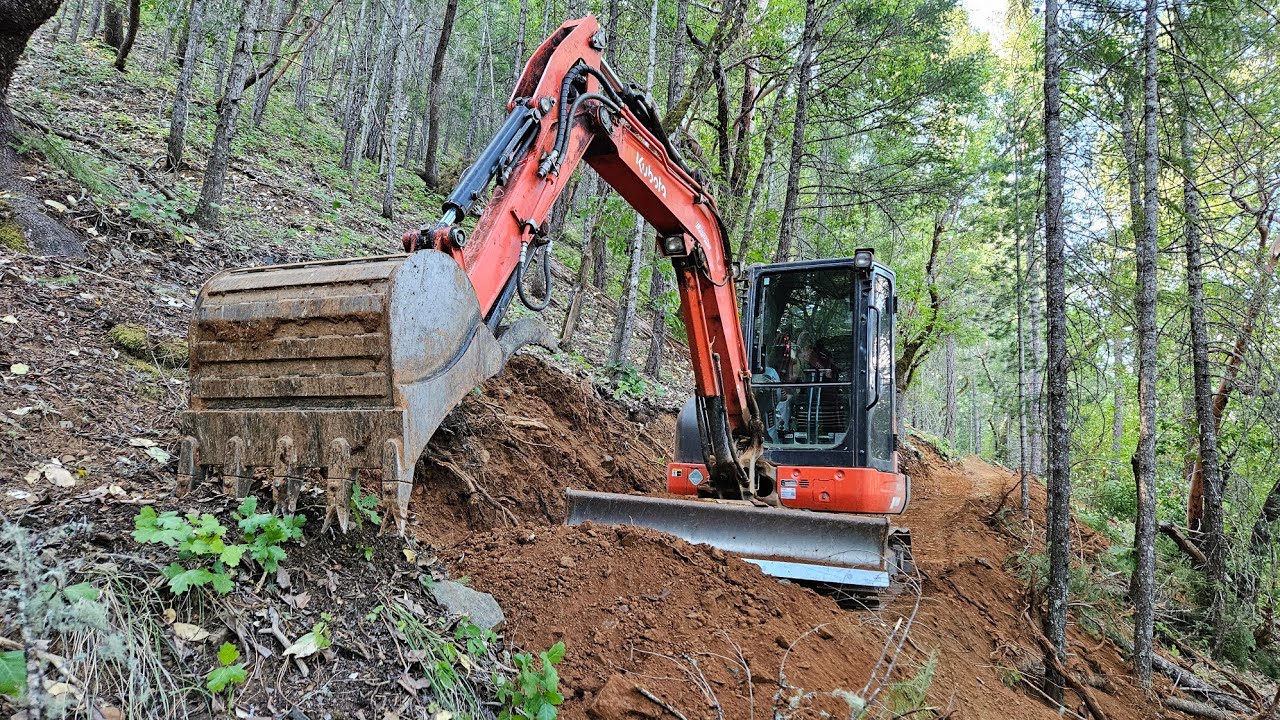 Steep ATV road difficult trees day 2 with the Kubota KX 040 4 excavator
