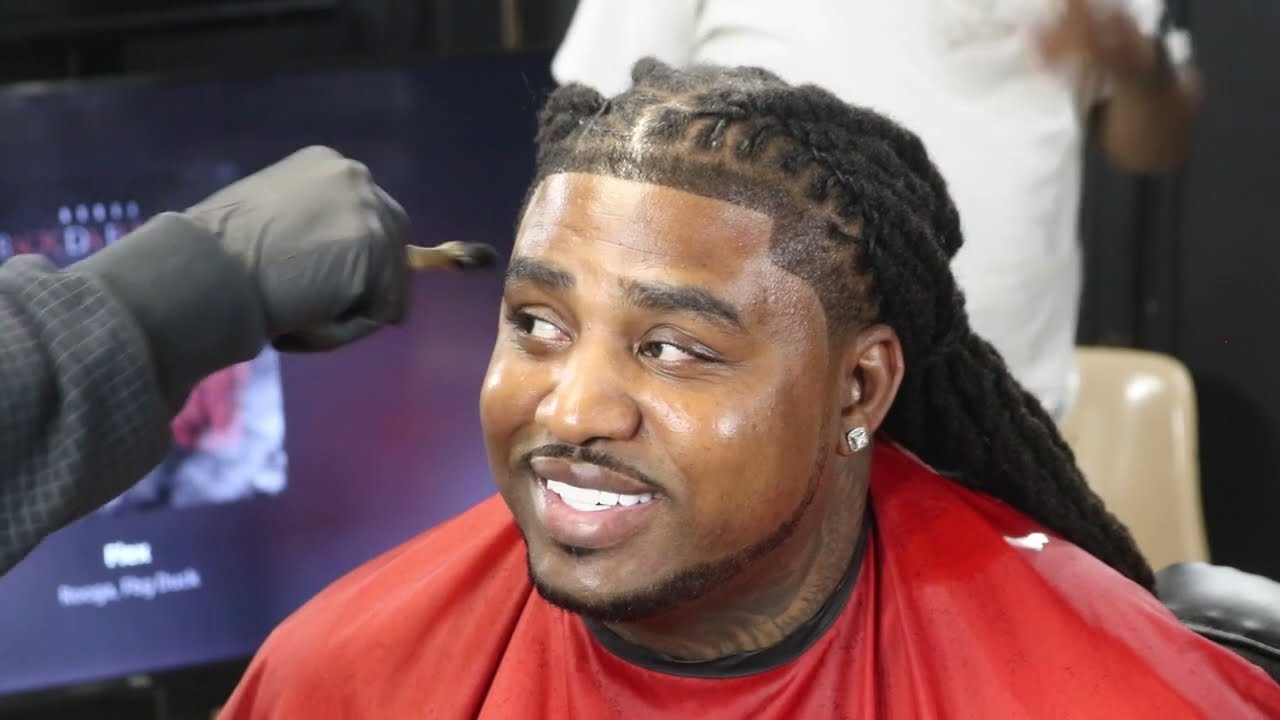 Jhe Rooga flys to chicago to get a cut from J R the barber