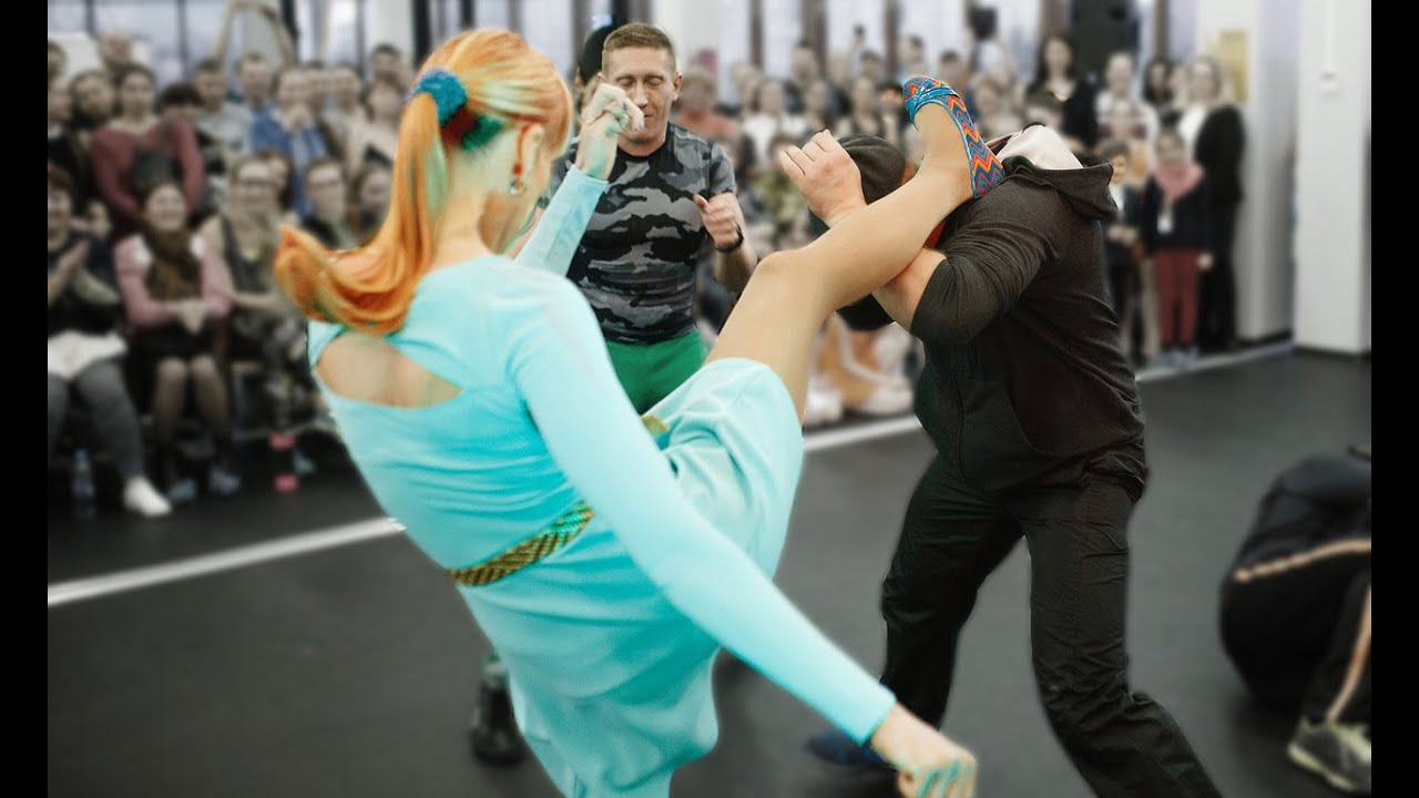 Fashion Model knocks out 3 Men at self-defence show. Real Fitness Bikini Karate Girl