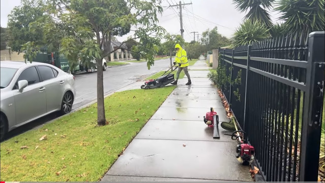 Lawn mowing on a wet rainy day