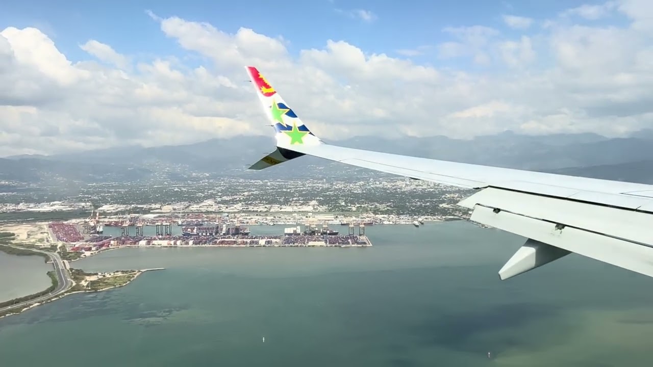 Landing Norman Manley International Airport Kingston Jamaica by Cayman Airways