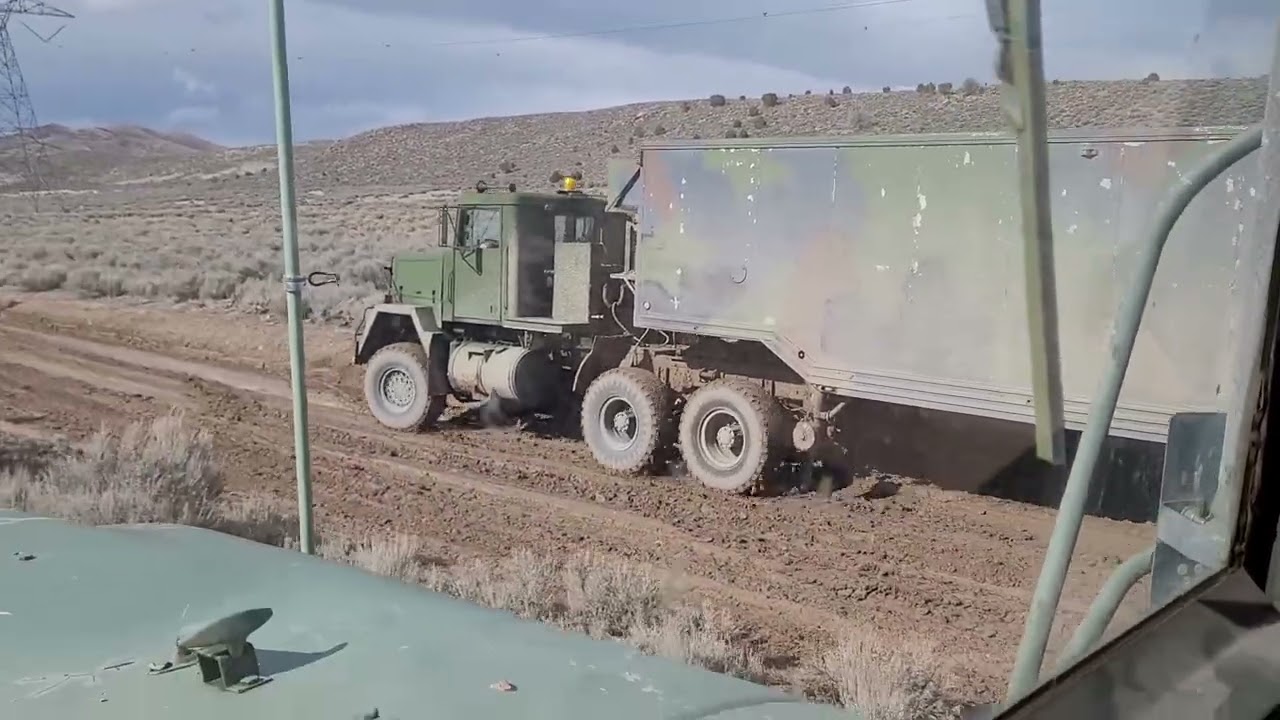 Military M916 6x6 Big Cam 855 Cummins pulling a 40' trailer in the mud!