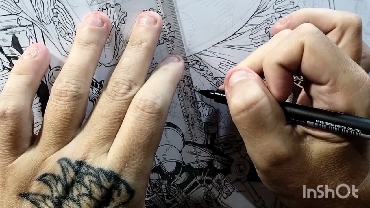 Inking a comics page.