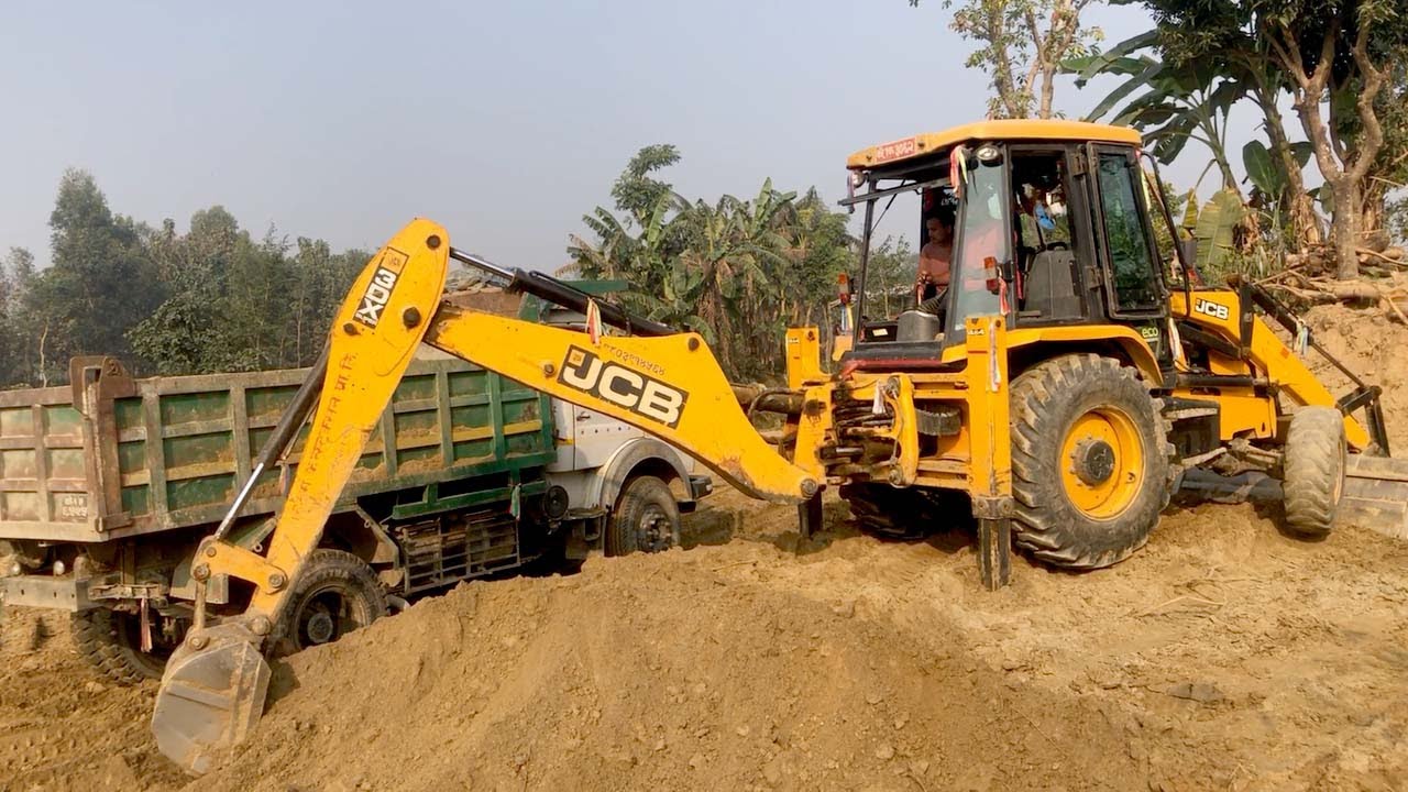 Soil Loading / Village Area JCB Backhoe Loading Soil In Dump