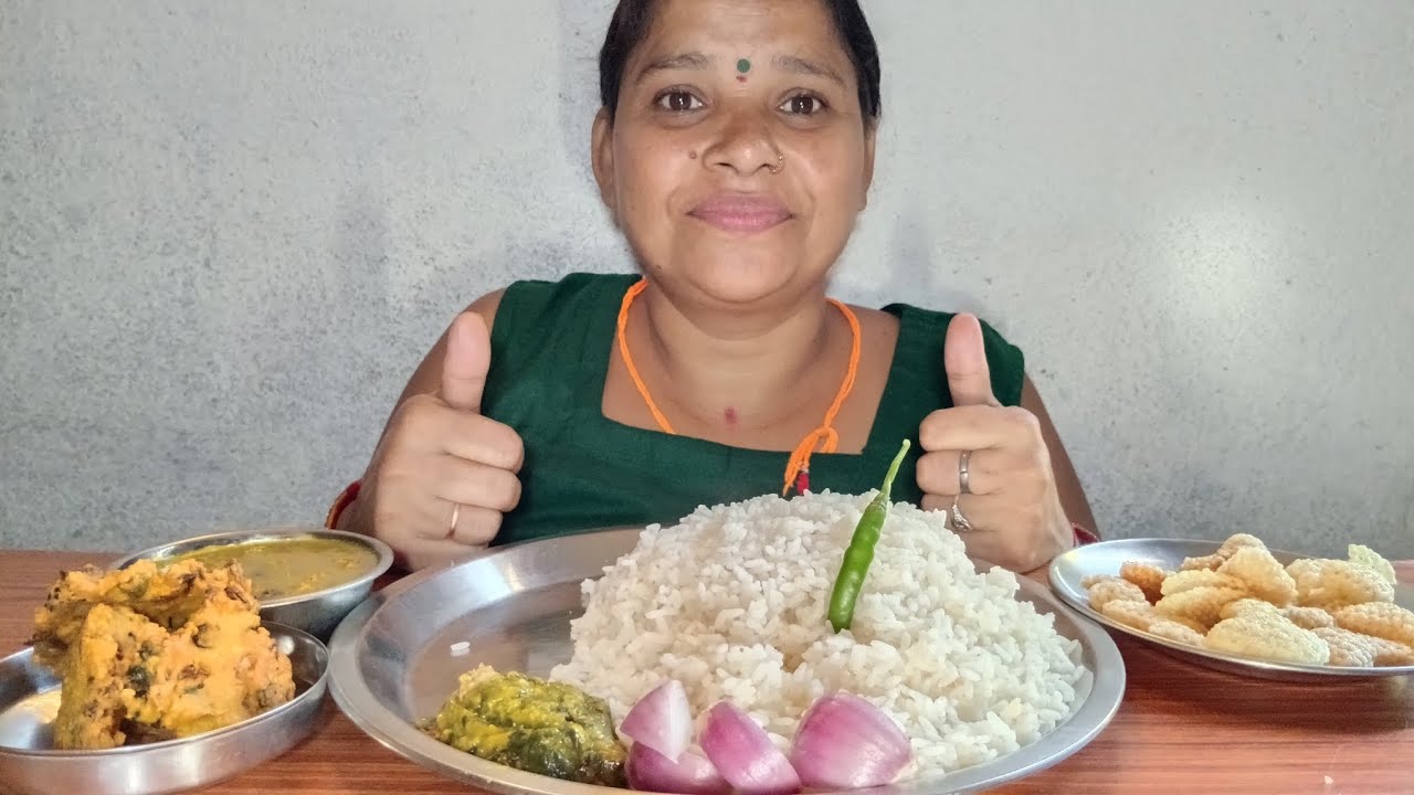Bigbite Eating With Rice, Soybean Aalu Ka Dal, Poi Kachhu ka Sabji, Pakoda And Papad 