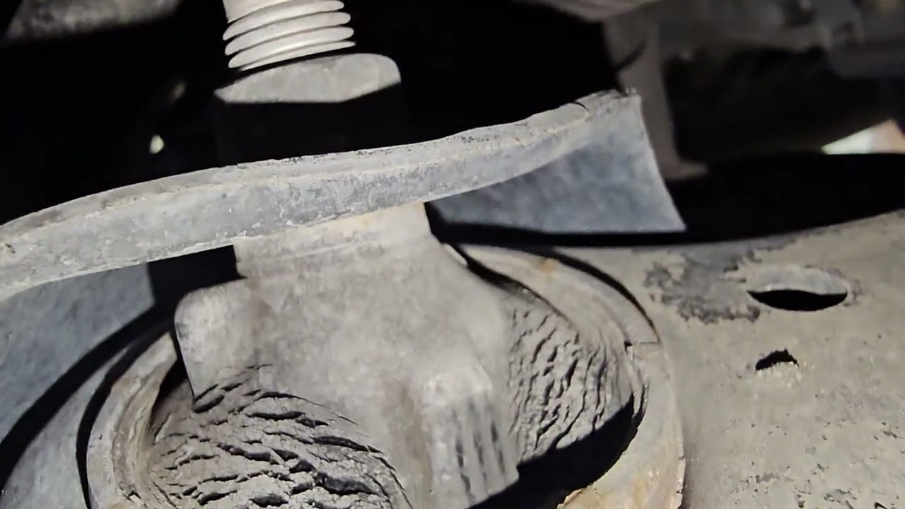 Both control arm bushings look torn....