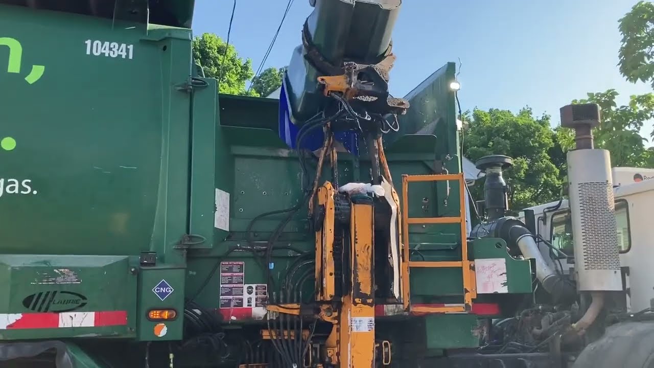 ￼A Roaring Garbage Truck Picking Up Tight Street Recycling ￼