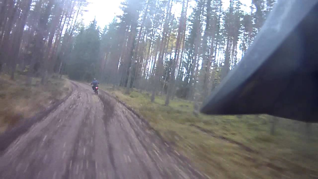 Husaberg 570 driving on a sandy road