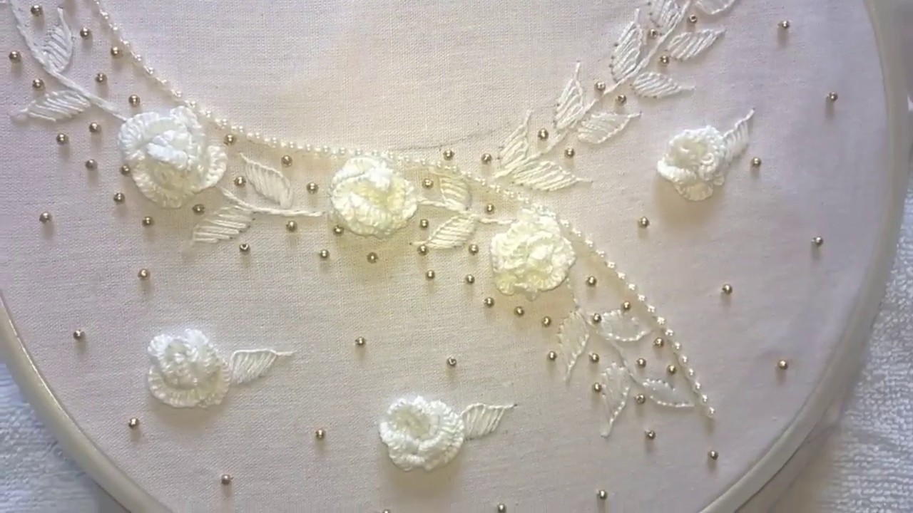 Hand embroidery.  Neckline embroidery. white work embroidery design.