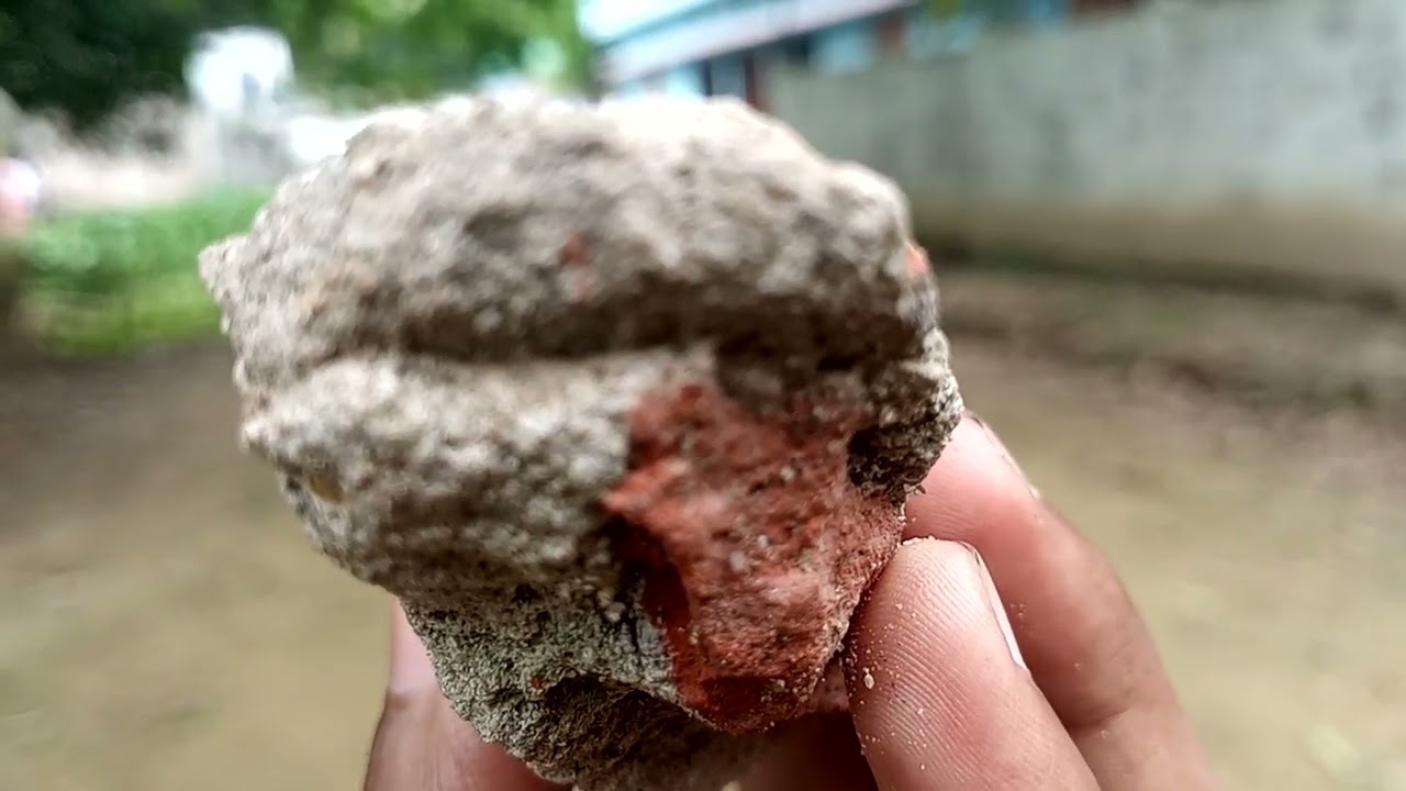Primeval Caveman Wearing Animal Skin Hits Rock with Sharp Stone and Makes First approach