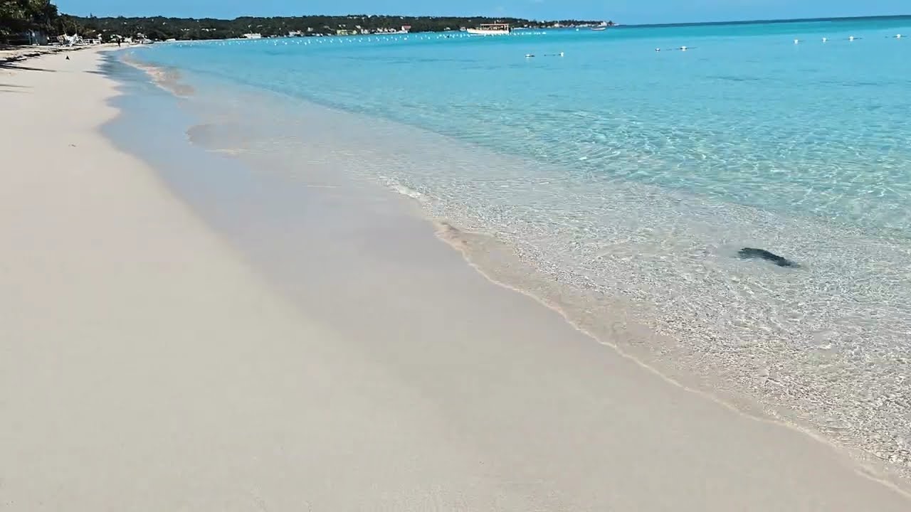 Relaxing: in Crystal clear water on 7-mile Beach