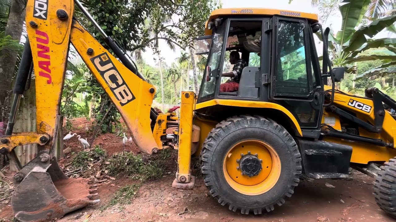 Jcb 3dx digging and loosening soil for starting cultivation 