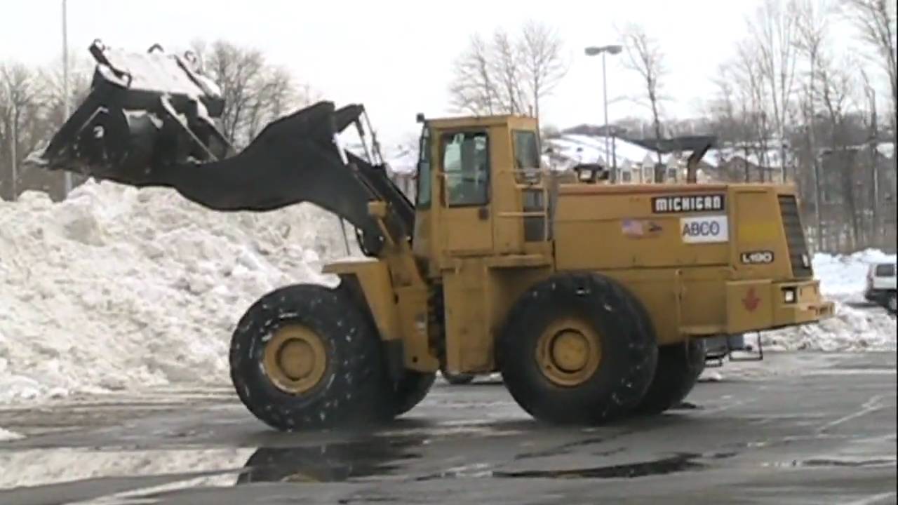 Michigan L190 wheel loader stockpiling snow