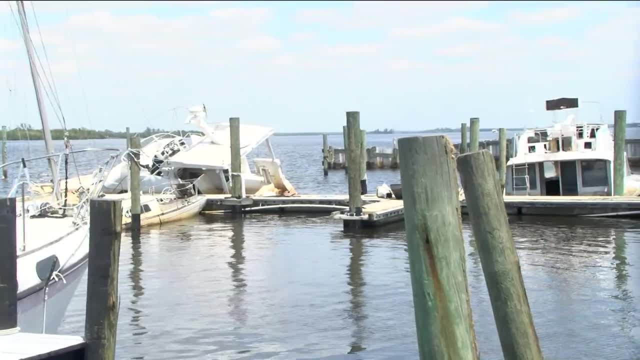 Damaged boats sit at Old Bridge Marina in North Fort Myers
