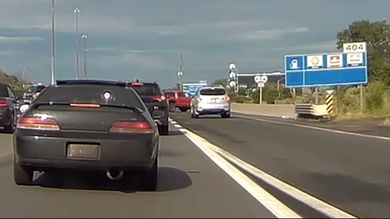 SUV jumping traffic queue gets blocked by pickup truck