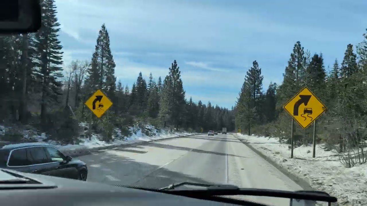 California USA mountain road snowing 