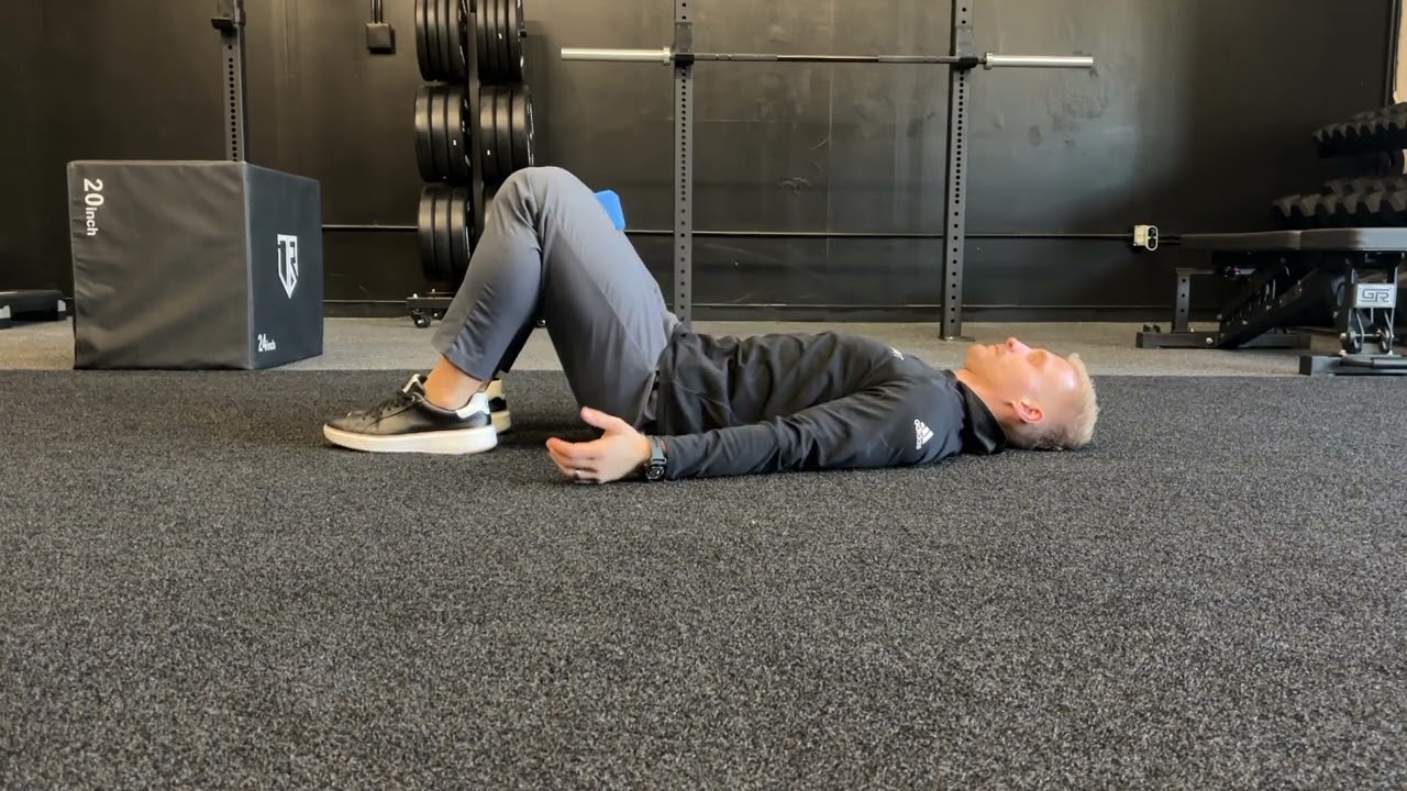 Hook-lying breathing with adductor squeeze 