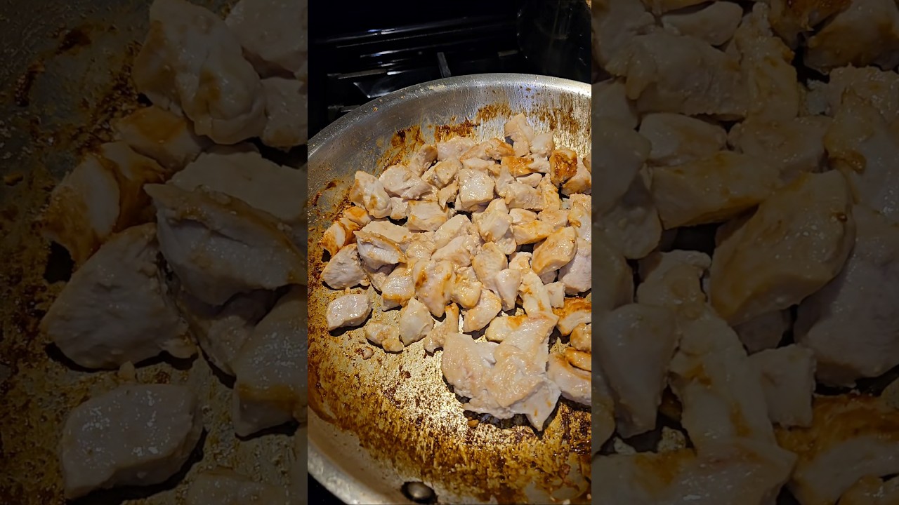 Cubed chicken breast on stainless steel