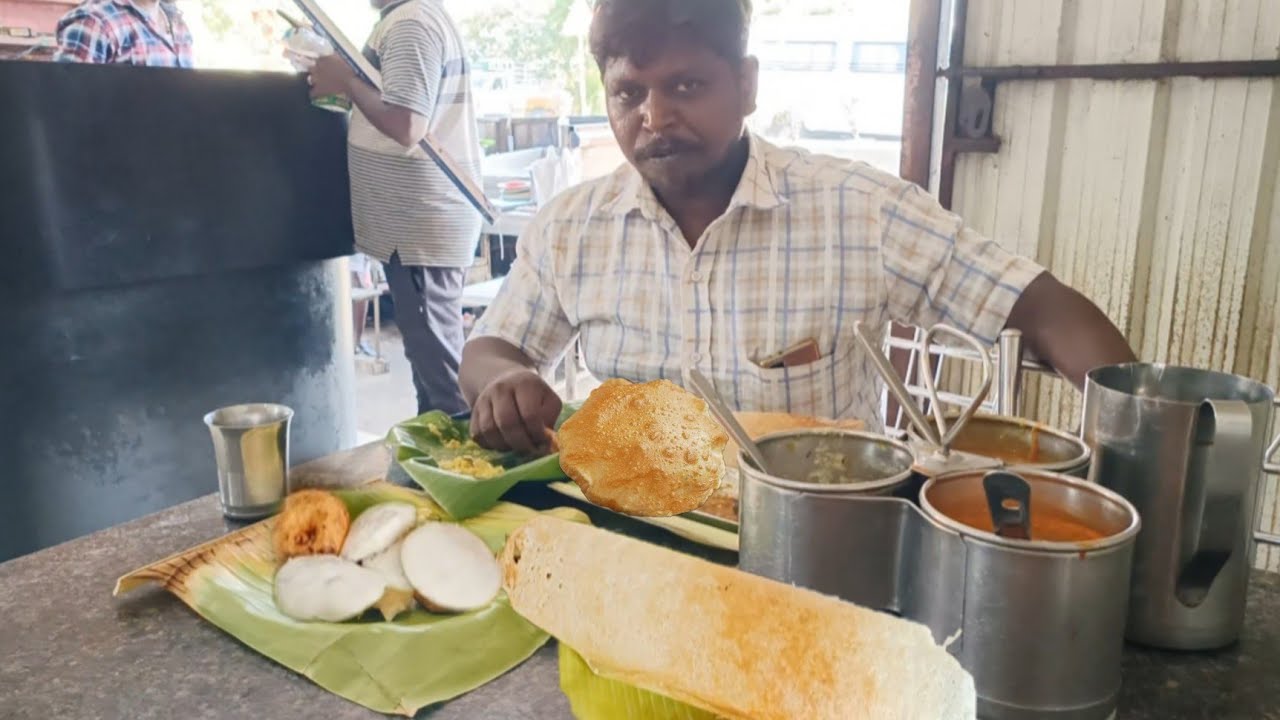 street food special paper ghee roast, poori potato masala, idli vadaikari, Pongal vada sambar eating